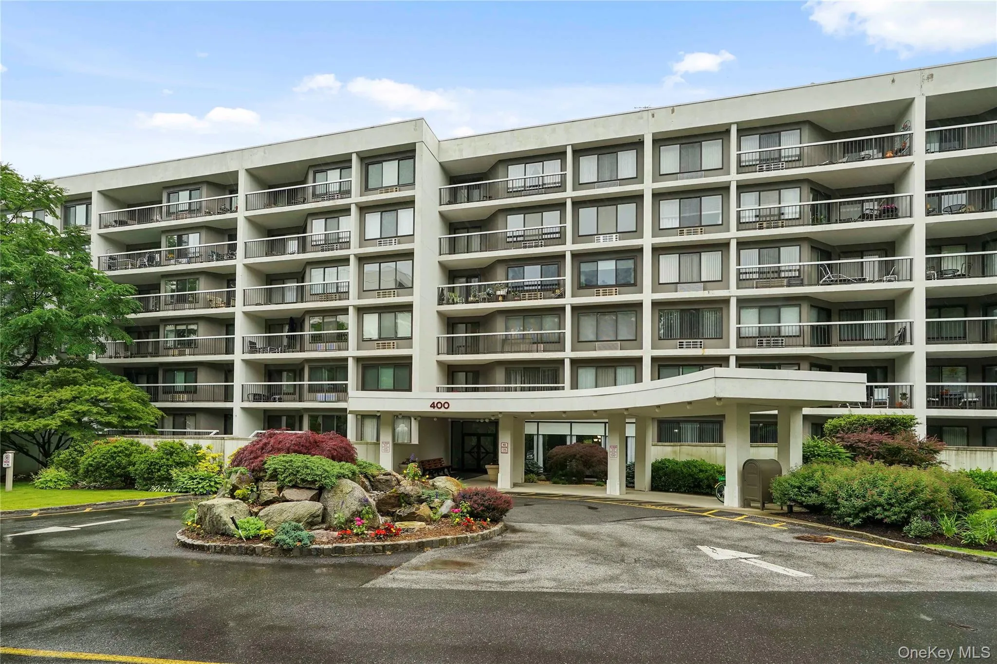 Front of the building with circular driveway. When the snow is gone, you’ll see the beautiful fountain and plantings. Front of the building with circular driveway. When the snow is gone, you’ll see the beautiful fountain and plantings.