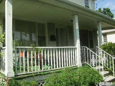 View of property exterior featuring covered porch View of property exterior featuring covered porch