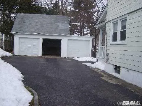View of snow covered garage View of snow covered garage