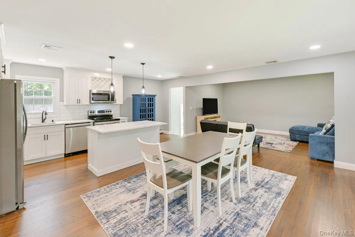 Dining area open to kitchen and living spaces Dining area open to kitchen and living spaces