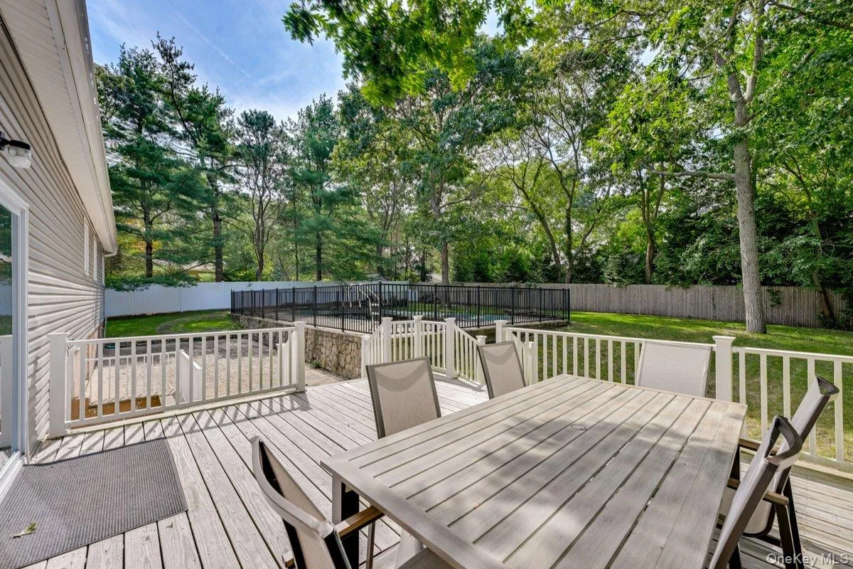 Relax on the spacious rear deck overlooking your heated 20x40 swimming pool Relax on the spacious rear deck overlooking your heated 20x40 swimming pool