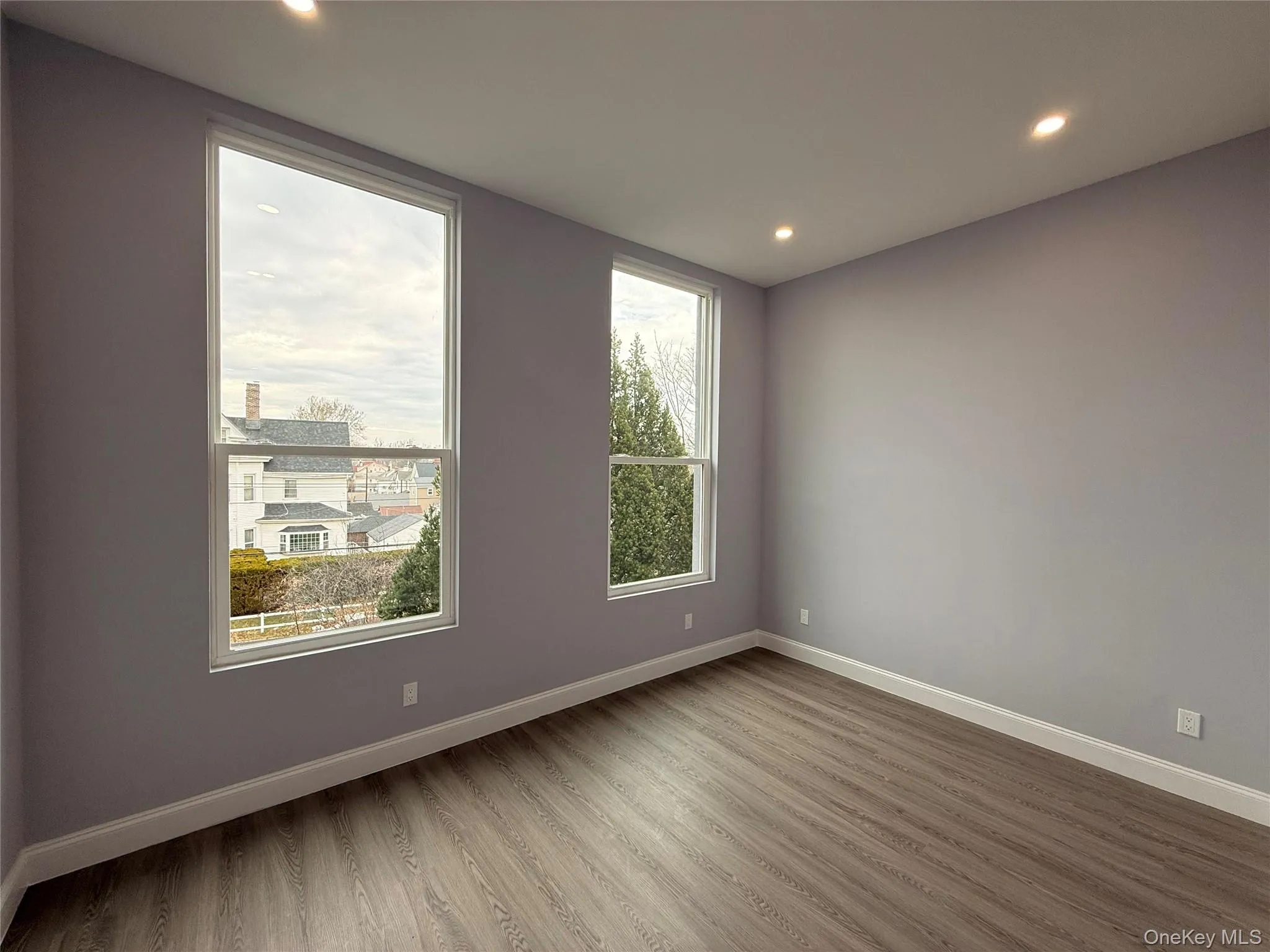 Bedroom #2 featuring light wood finished floors and recessed lighting Bedroom #2 featuring light wood finished floors and recessed lighting