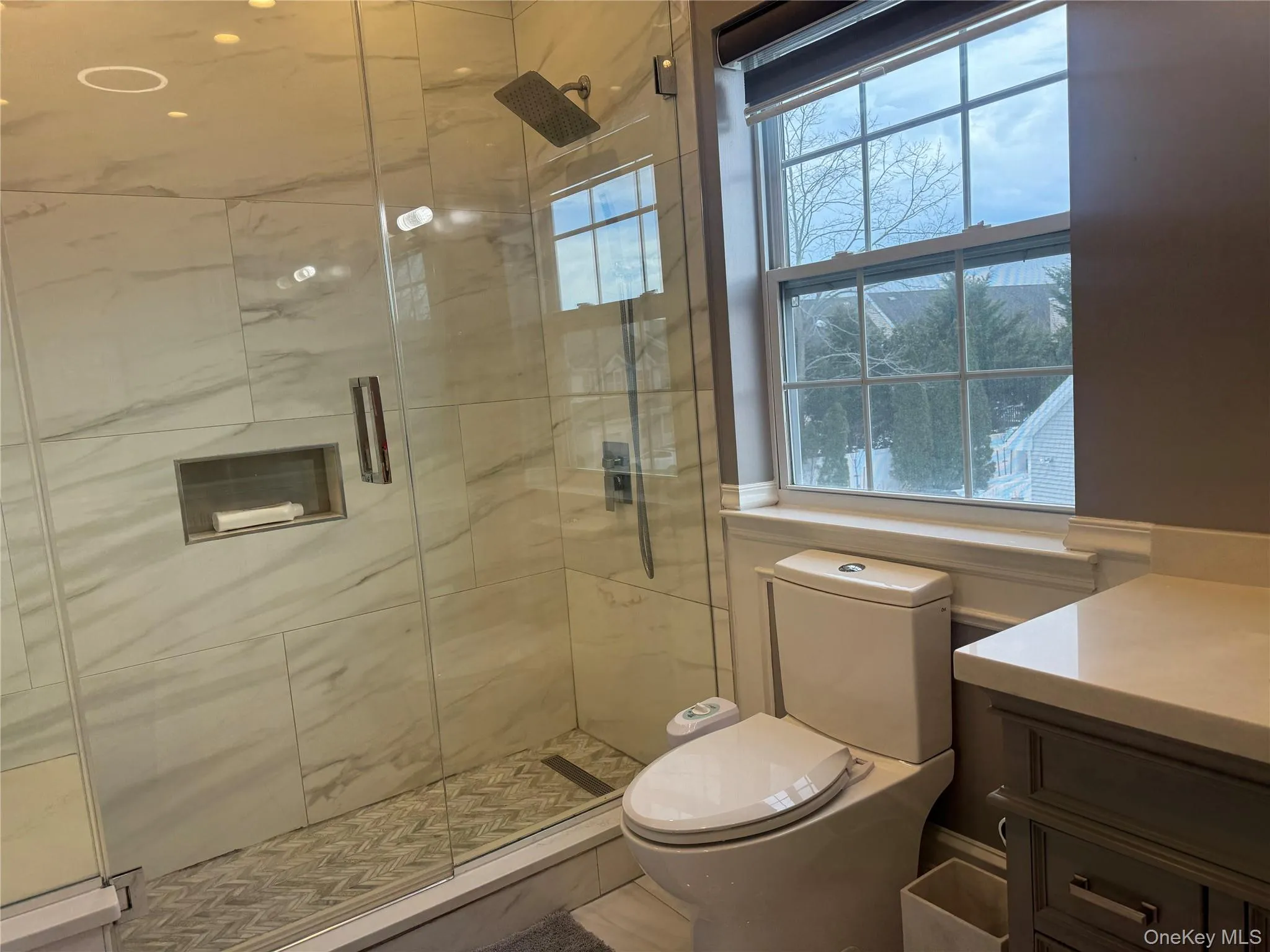 Full bathroom featuring vanity and a stall shower Full bathroom featuring vanity and a stall shower