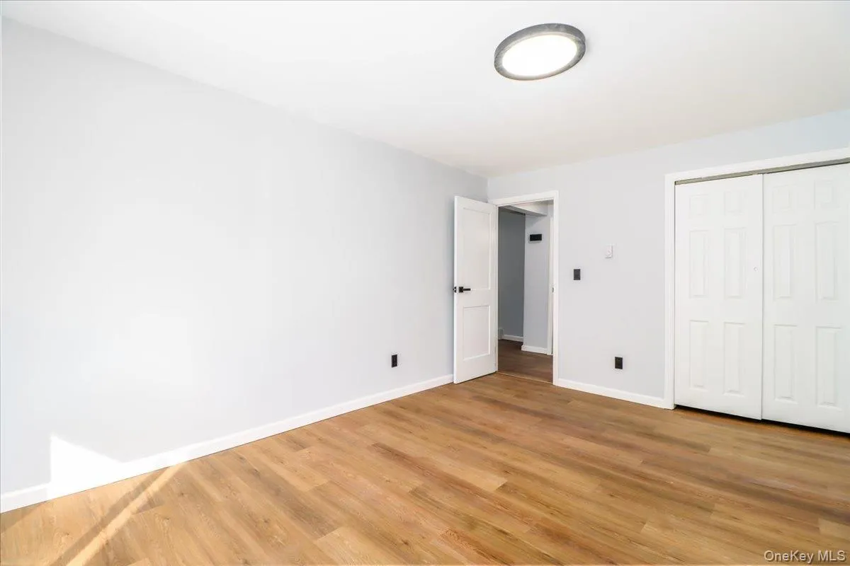 Spacious Bedroom, with sliders out to patio, freshly painted , new flooring Spacious Bedroom, with sliders out to patio, freshly painted , new flooring