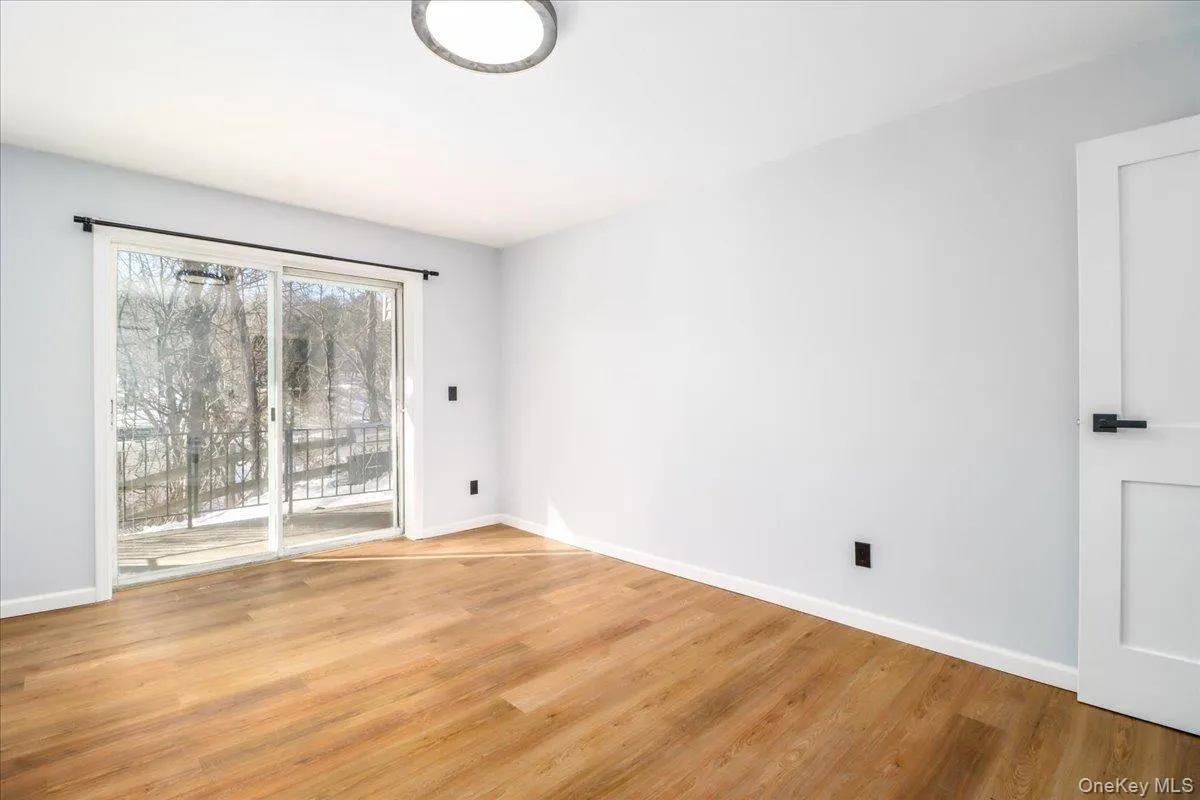 Spacious Bedroom, with sliders out to patio, freshly painted , new flooring Spacious Bedroom, with sliders out to patio, freshly painted , new flooring