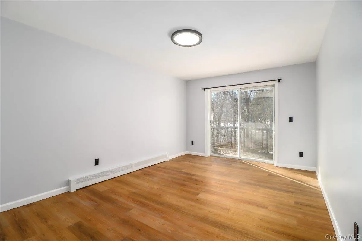 Spacious Bedroom, with sliders out to patio, freshly painted , new flooring Spacious Bedroom, with sliders out to patio, freshly painted , new flooring