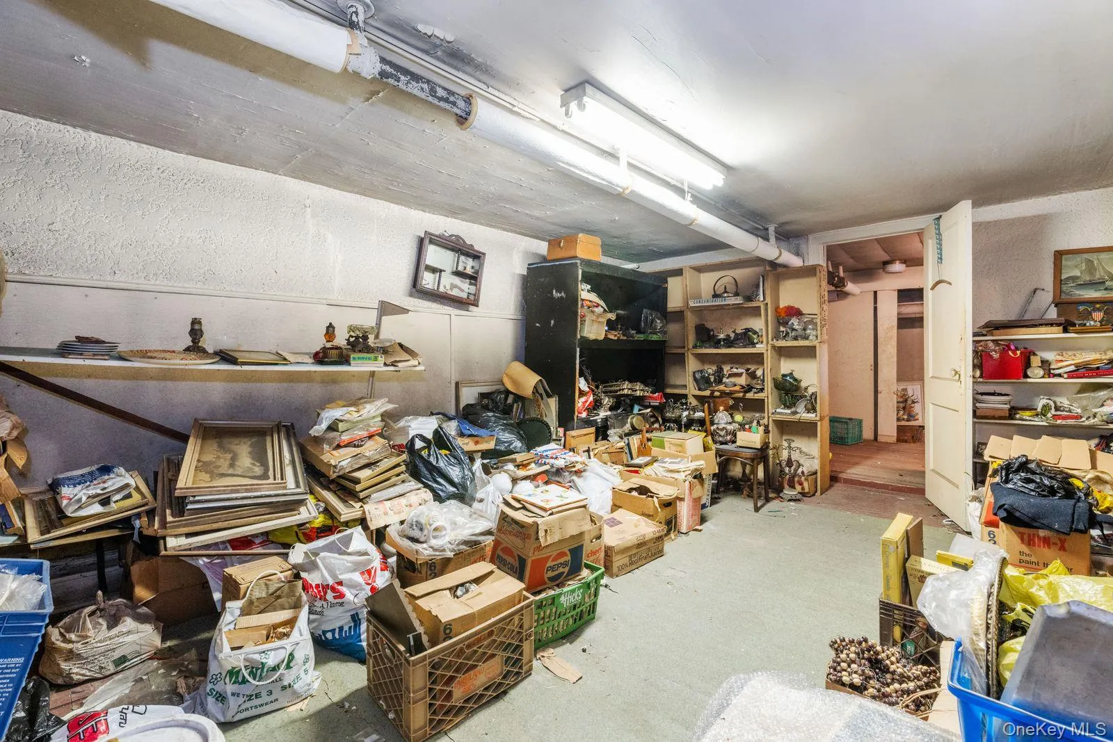 This basement family room currently used as storage room. This basement family room currently used as storage room.
