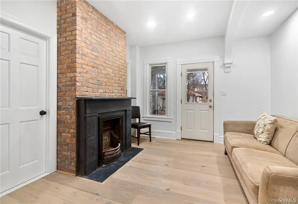 Living Room with Exposed Brick Fireplace Area Living Room with Exposed Brick Fireplace Area