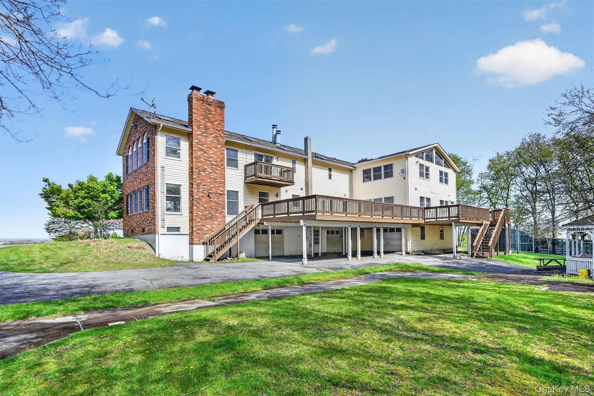 Plenty of deck space, a gazebo and a firepit area make the backyard a fun play area! Plenty of deck space, a gazebo and a firepit area make the backyard a fun play area!
