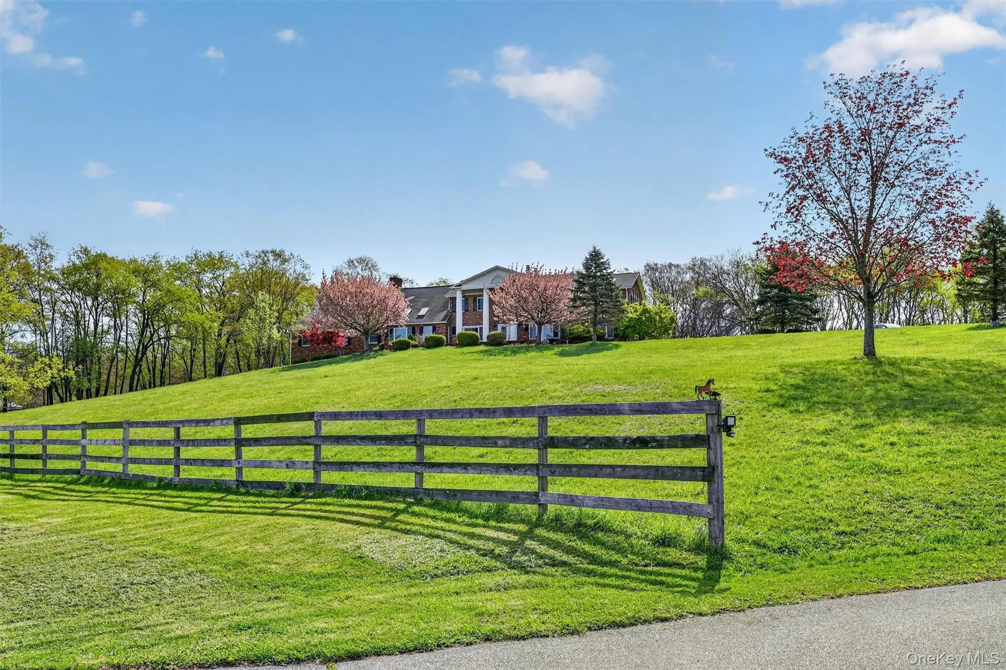 Stately Federal style brick home overlooks the farm and beyond. Stately Federal style brick home overlooks the farm and beyond.