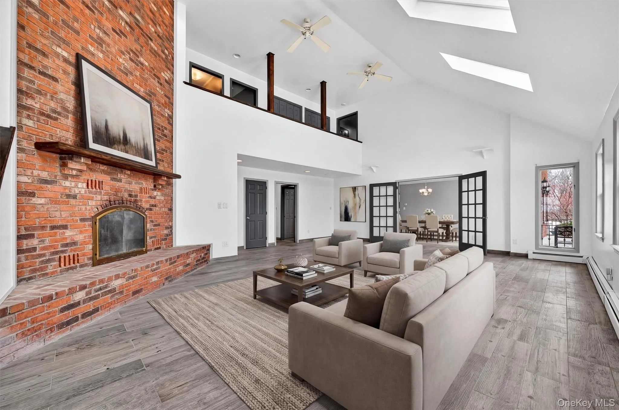 Enjoy the centerpiece brick fireplace while entertaining guests. There's plenty of room for a party!Virtually Staged Enjoy the centerpiece brick fireplace while entertaining guests. There's plenty of room for a party!Virtually Staged