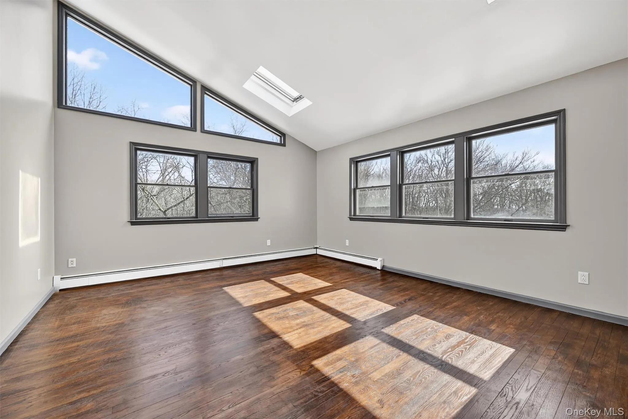 Two of the five bedrooms feature trapezoidal windows and skylights Two of the five bedrooms feature trapezoidal windows and skylights