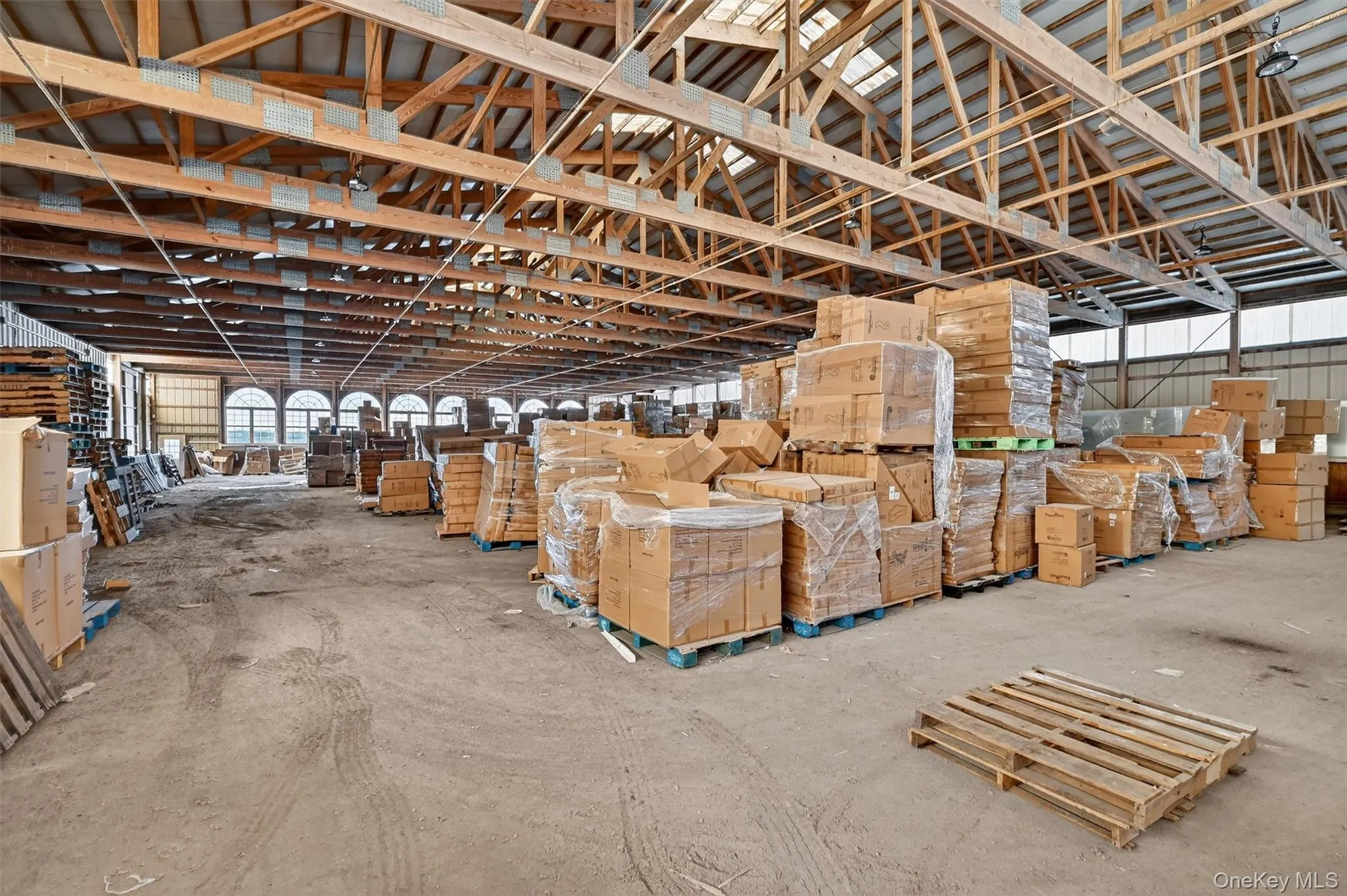 Indoor arena featuring new overhead lighting and sprinkler system Of course the inventory being stored here will be removed Indoor arena featuring new overhead lighting and sprinkler system Of course the inventory being stored here will be removed