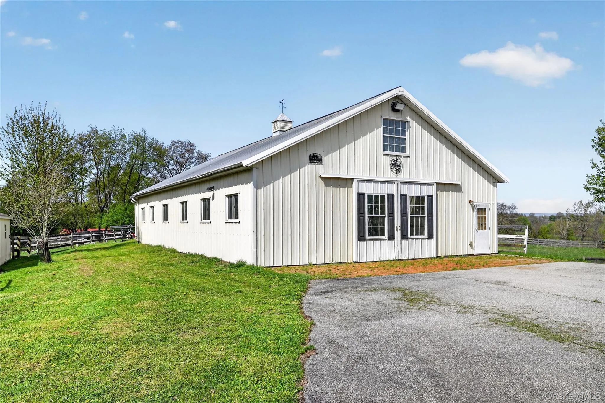 Second barn is close to turnout and has 15 stalls, a hot/cold outside wash stall and a large office. Second barn is close to turnout and has 15 stalls, a hot/cold outside wash stall and a large office.
