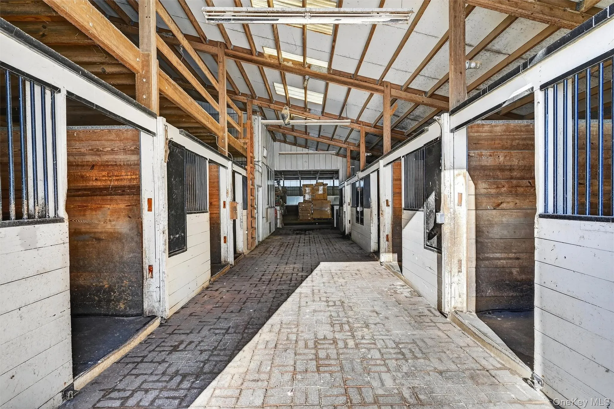 One of two brick aisleway in the main barn. No going outside in inclement weather to get to the indoor! One of two brick aisleway in the main barn. No going outside in inclement weather to get to the indoor!