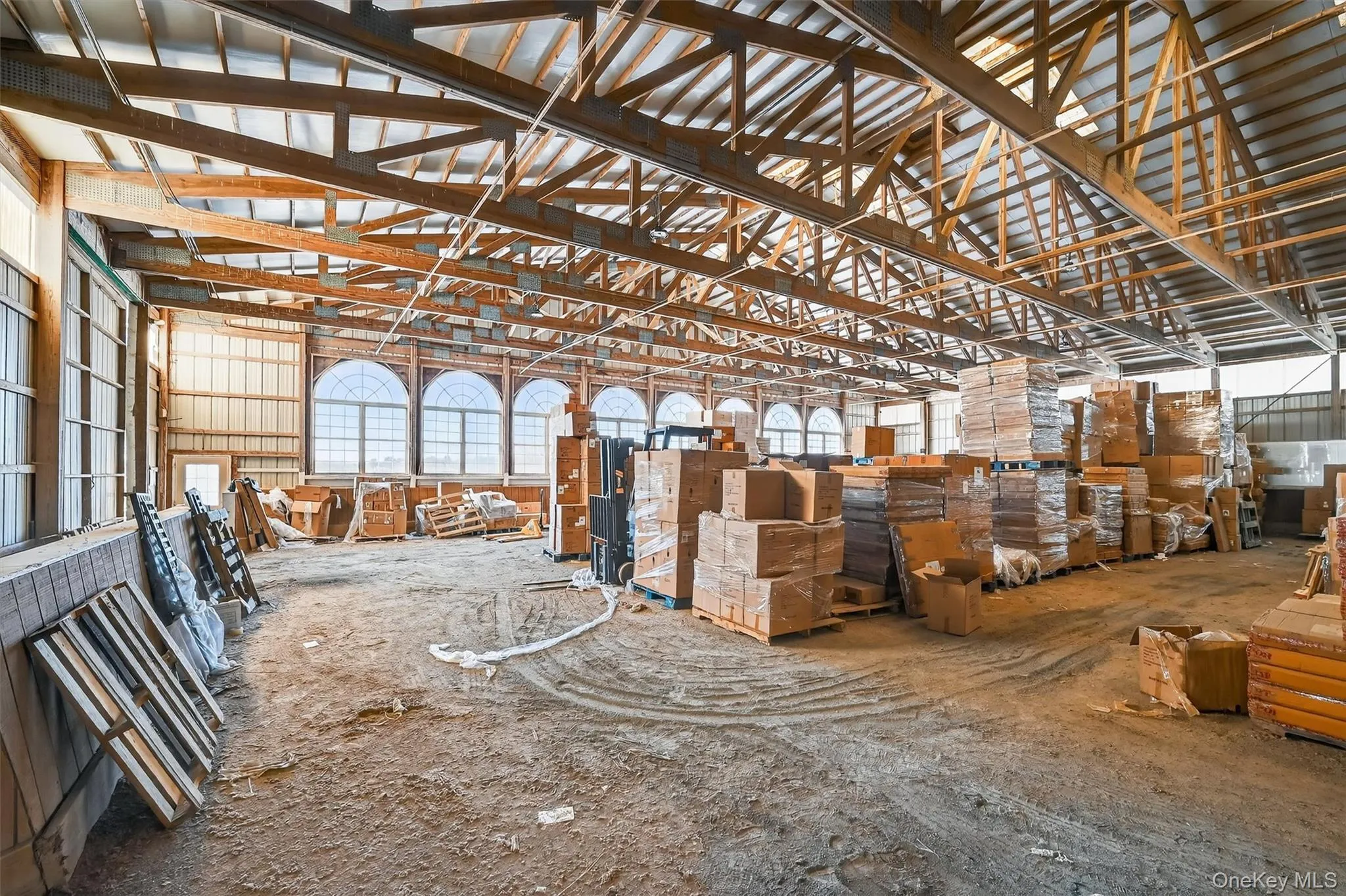 Large indoor arena has 8 Palladian windows for plenty of natural light and new overhead lights for evening rides. Large indoor arena has 8 Palladian windows for plenty of natural light and new overhead lights for evening rides.