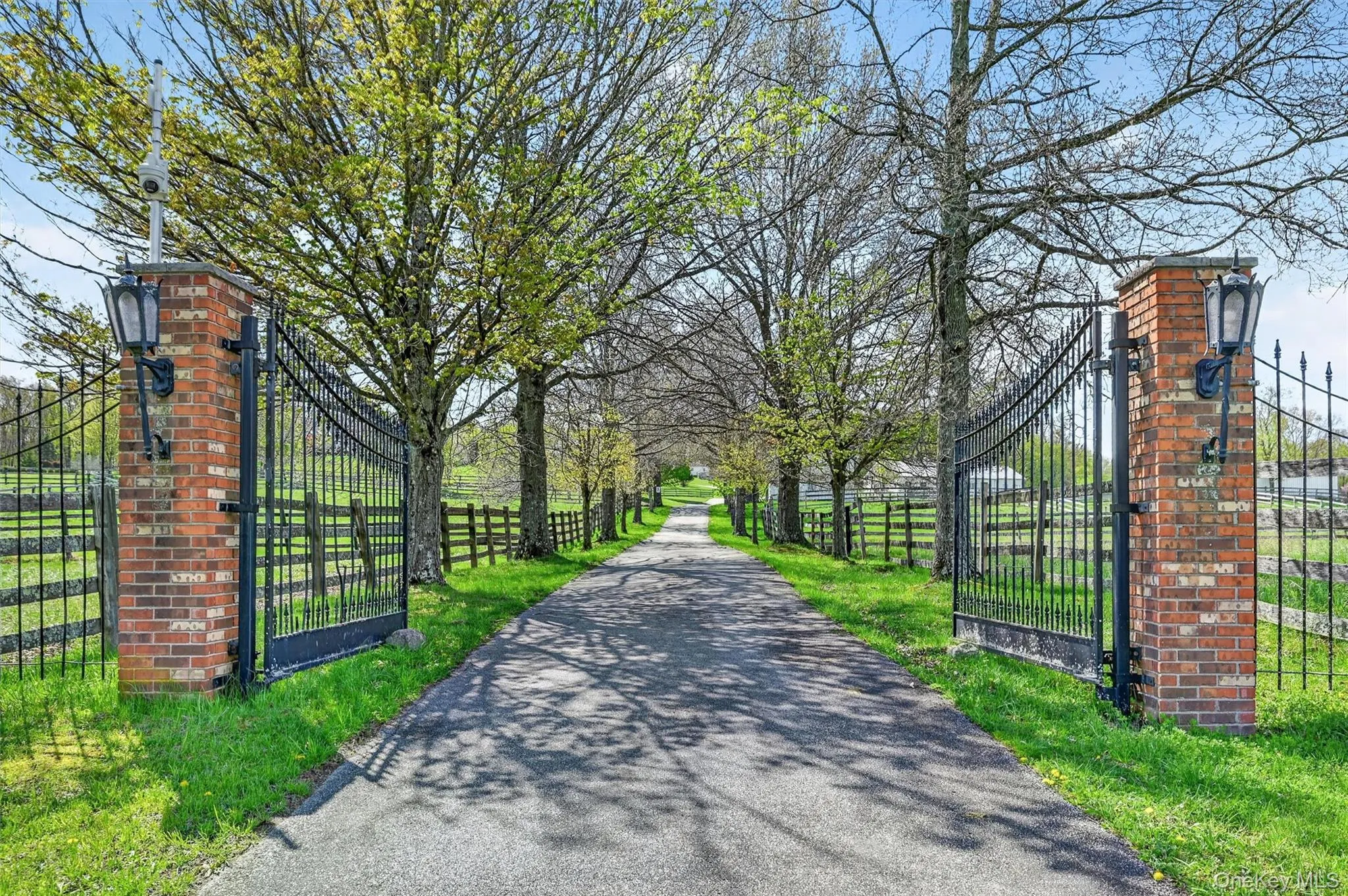 The welcoming and stately columned gate provides a traditional entry for guests and clients. The welcoming and stately columned gate provides a traditional entry for guests and clients.