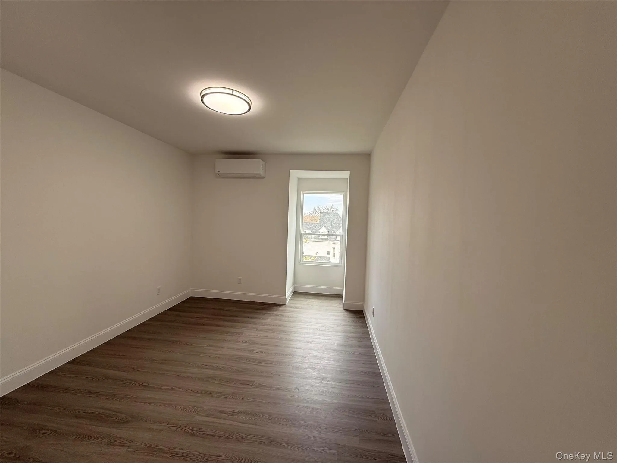 Bedroom #3 with baseboards and dark wood-type flooring Bedroom #3 with baseboards and dark wood-type flooring