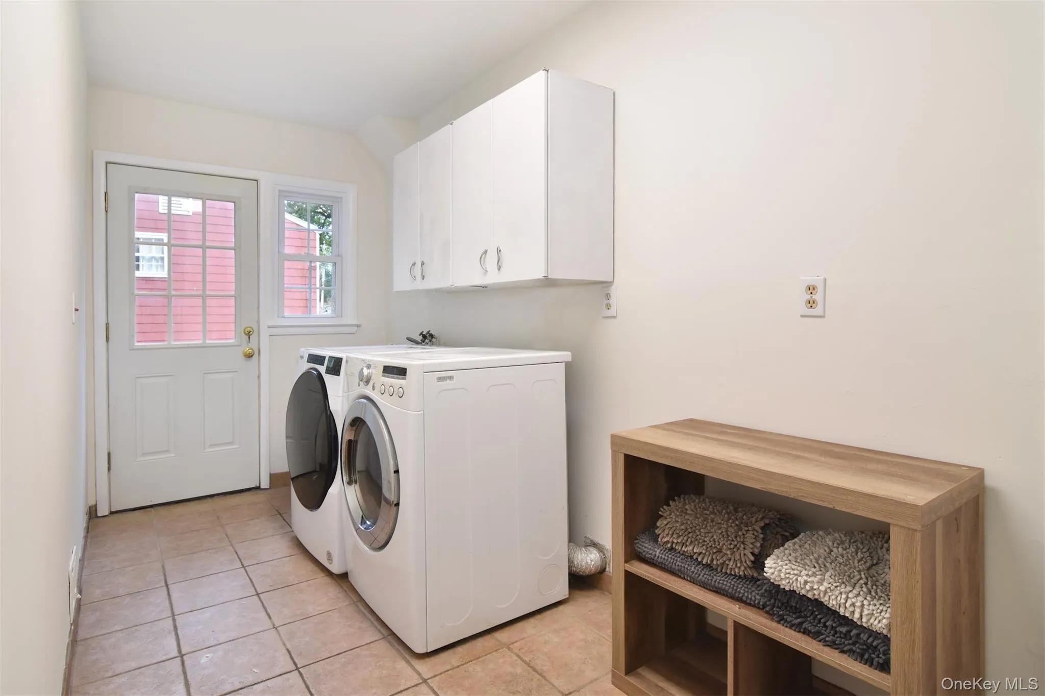A laundry room is also on this level, conveniently located off of the kitchen. A laundry room is also on this level, conveniently located off of the kitchen.