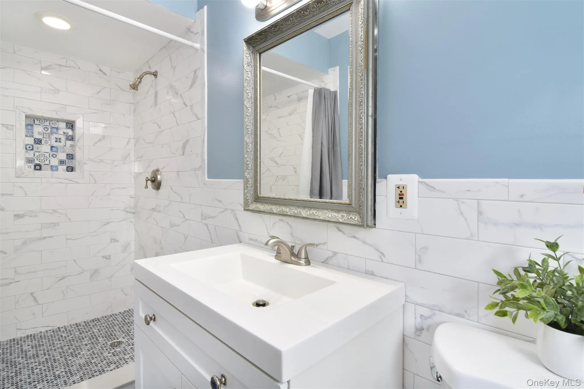 A step-in shower. A serene retreat. A step-in shower. A serene retreat.