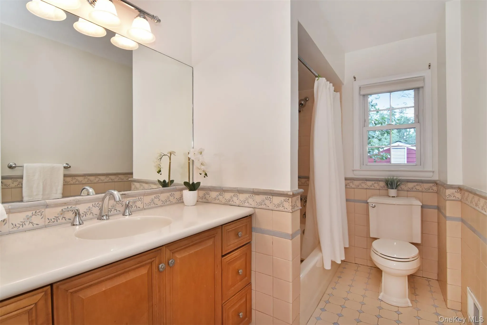 A hall bathroom with classic tiling completes the second floor. A hall bathroom with classic tiling completes the second floor.