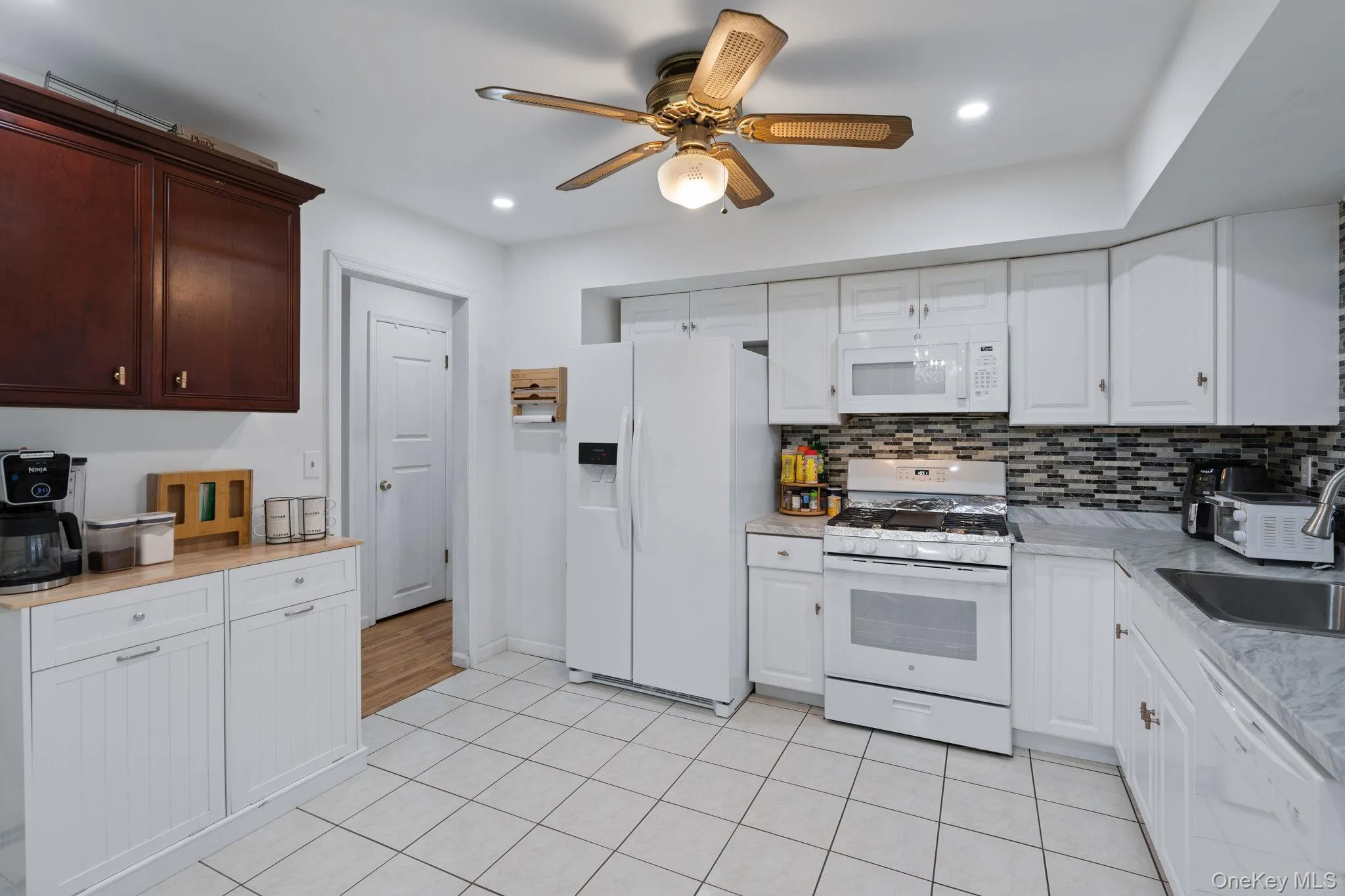 Fully renovated with new appliances, cabinets, counters and tile flooring, leads to enclosed deck. Fully renovated with new appliances, cabinets, counters and tile flooring, leads to enclosed deck.
