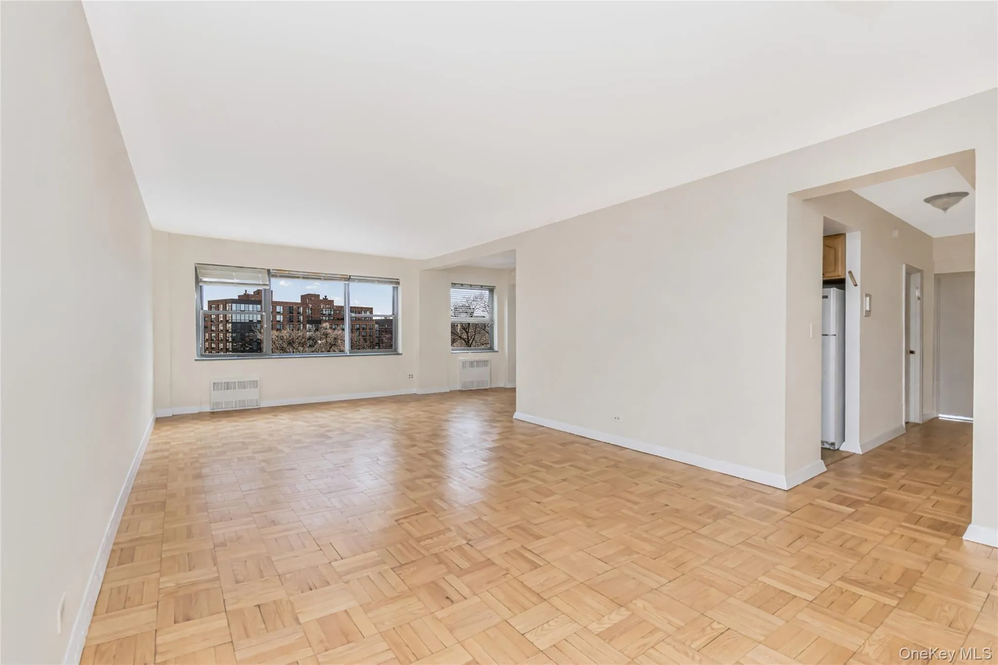 Living room with parquet flooring and radiator Living room with parquet flooring and radiator