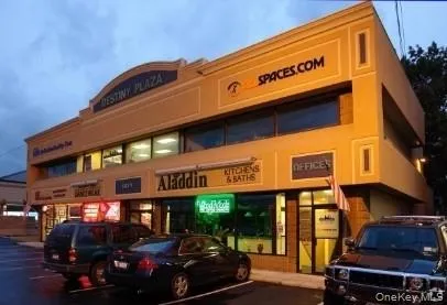 View of commercial location featuring parking lot (More parking available) View of commercial location featuring parking lot (More parking available)