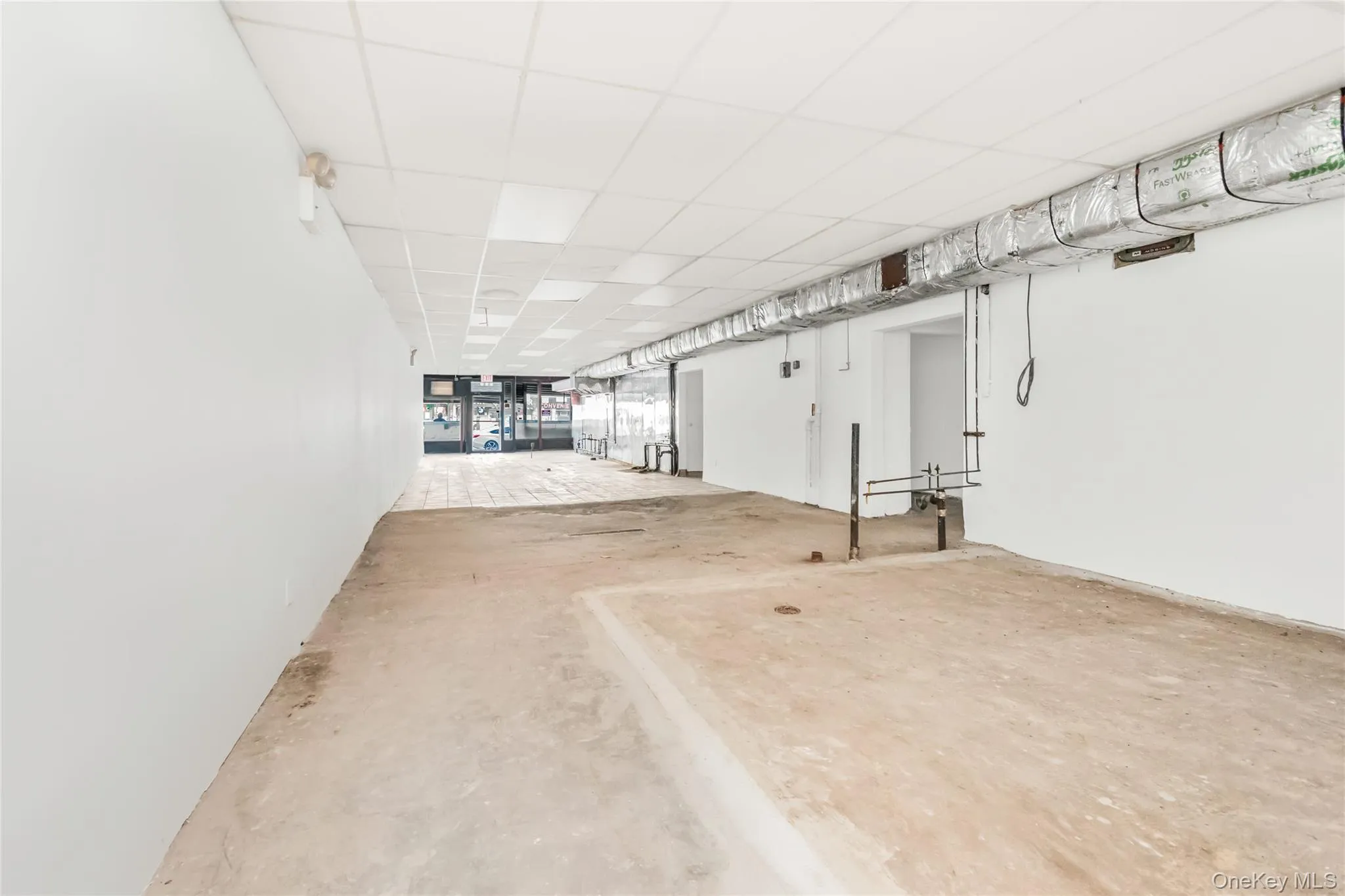 Room with a paneled ceiling Room with a paneled ceiling