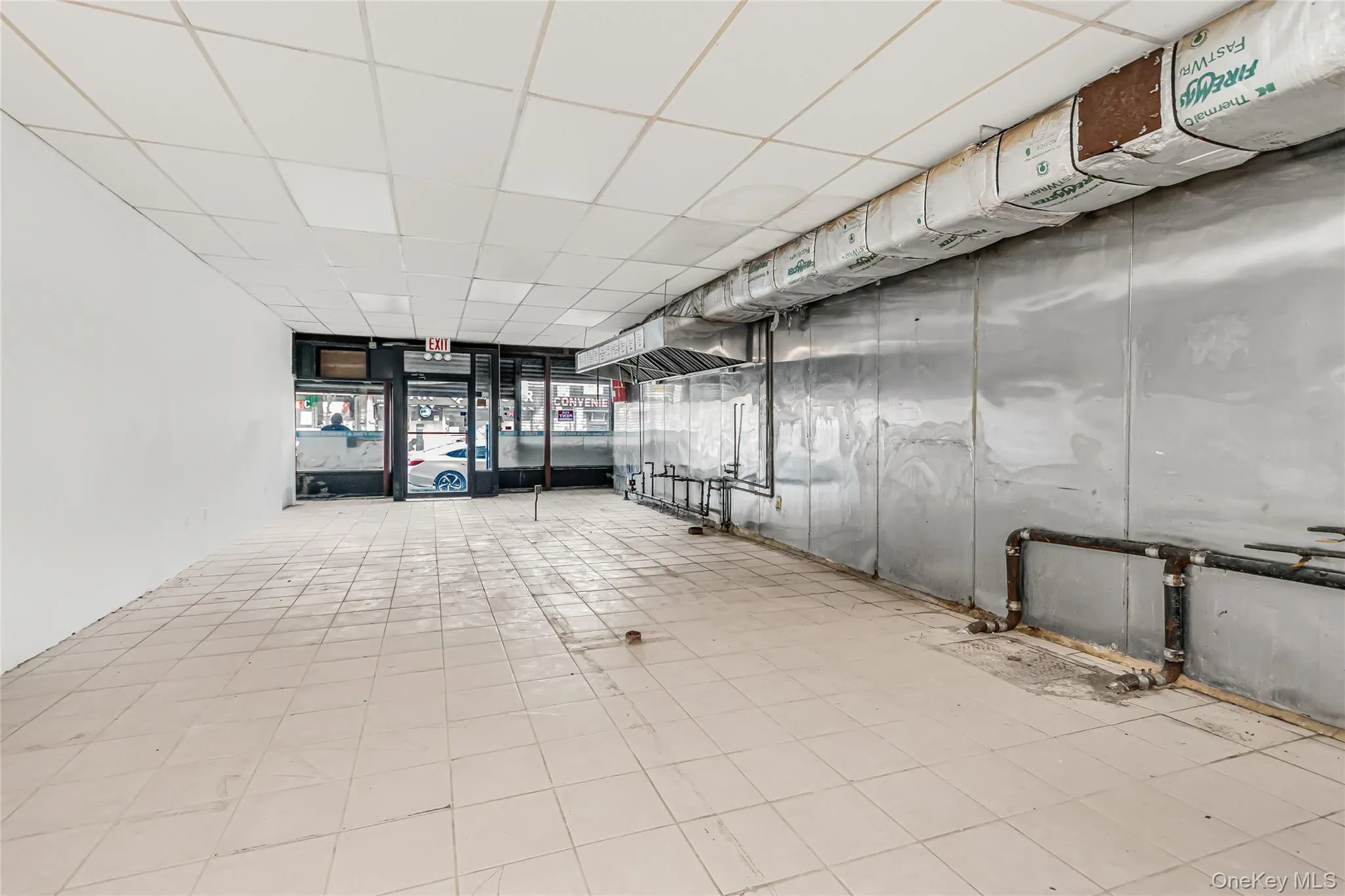 Room with a paneled ceiling Room with a paneled ceiling