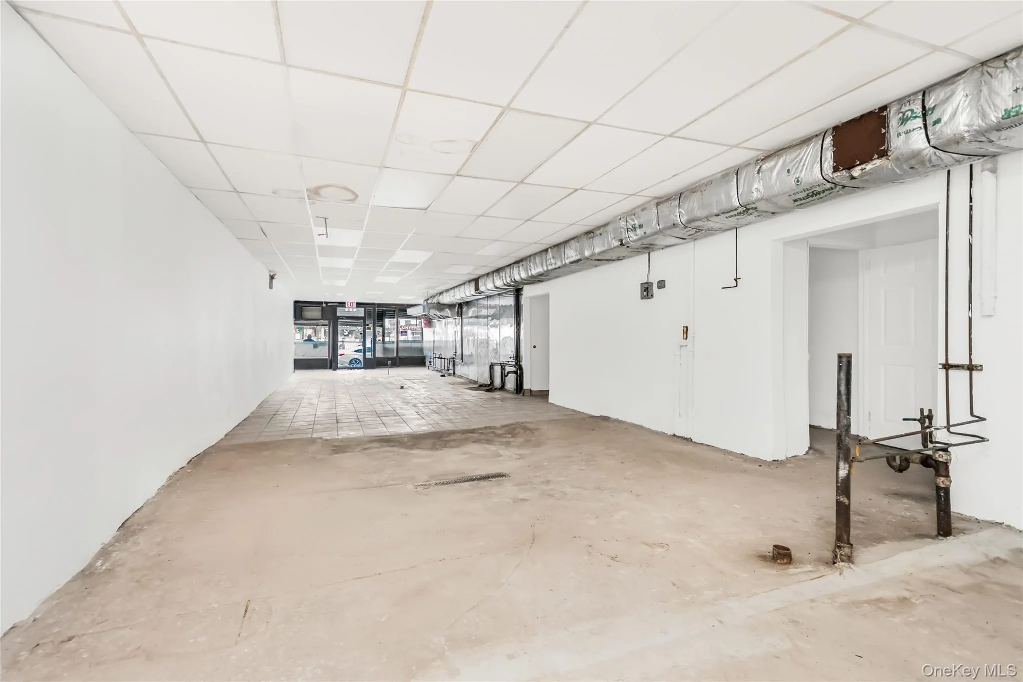 Room with a paneled ceiling Room with a paneled ceiling