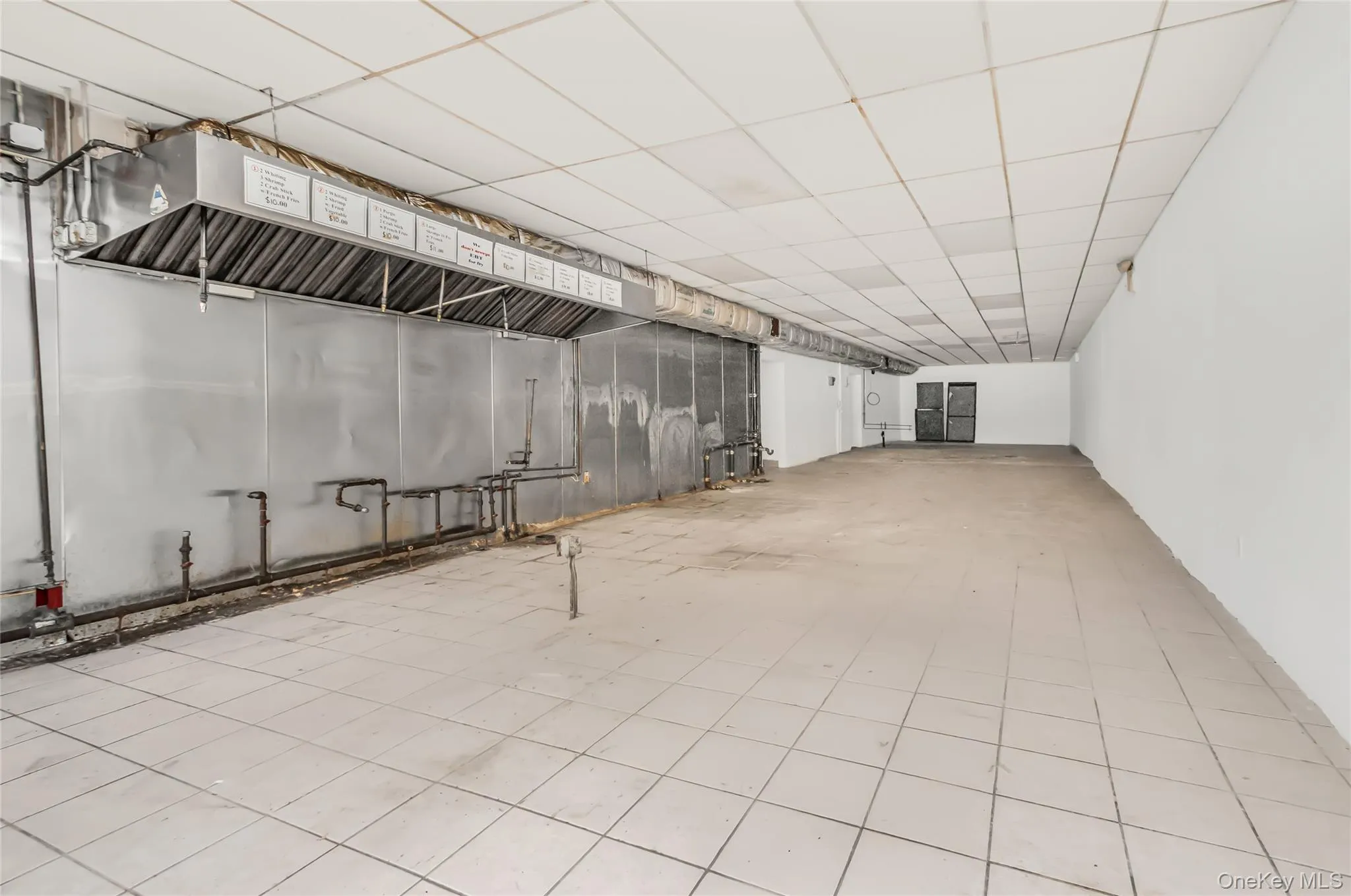 Room with a paneled ceiling Room with a paneled ceiling