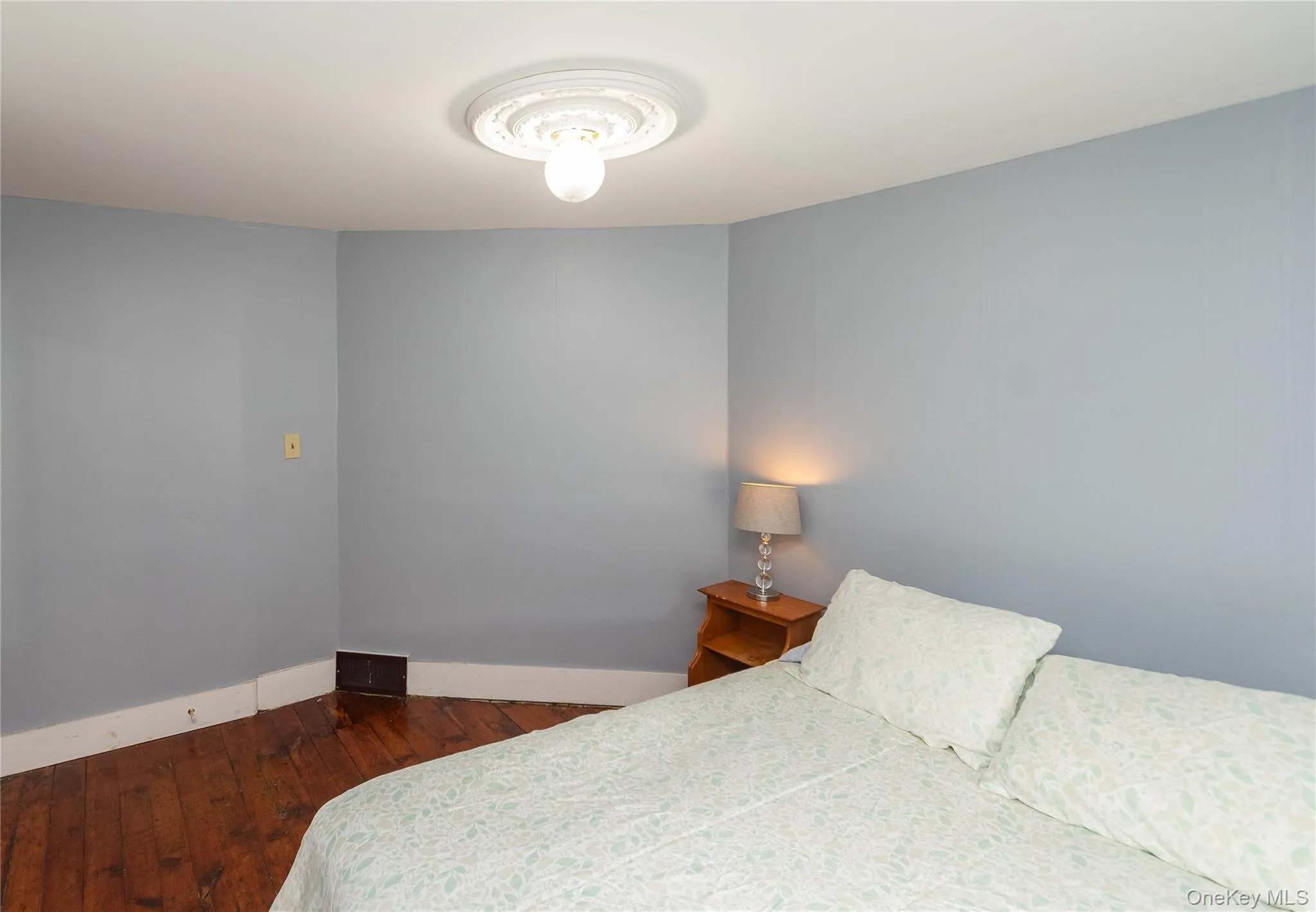 Pale blue walls complement a white ceiling with a decorative ceiling medallion Pale blue walls complement a white ceiling with a decorative ceiling medallion