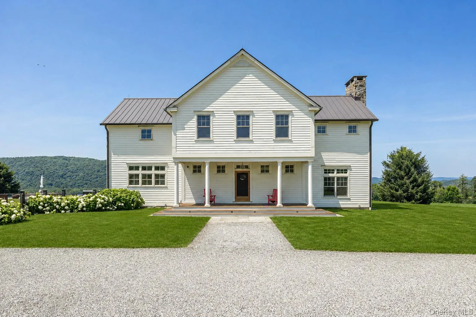 A Lovely Porch at the Back of the Home Makes a Lovely Place to Sit and Greet Arriving Guests or Watch the Sun Rise A Lovely Porch at the Back of the Home Makes a Lovely Place to Sit and Greet Arriving Guests or Watch the Sun Rise