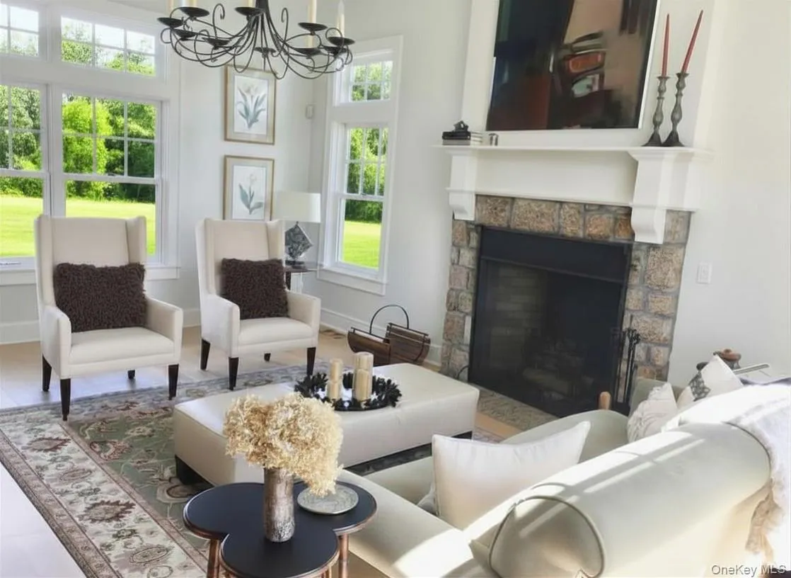 The Charming, Light-Filled Den with Fireplace Offers Another Wonderful Place to Relax The Charming, Light-Filled Den with Fireplace Offers Another Wonderful Place to Relax