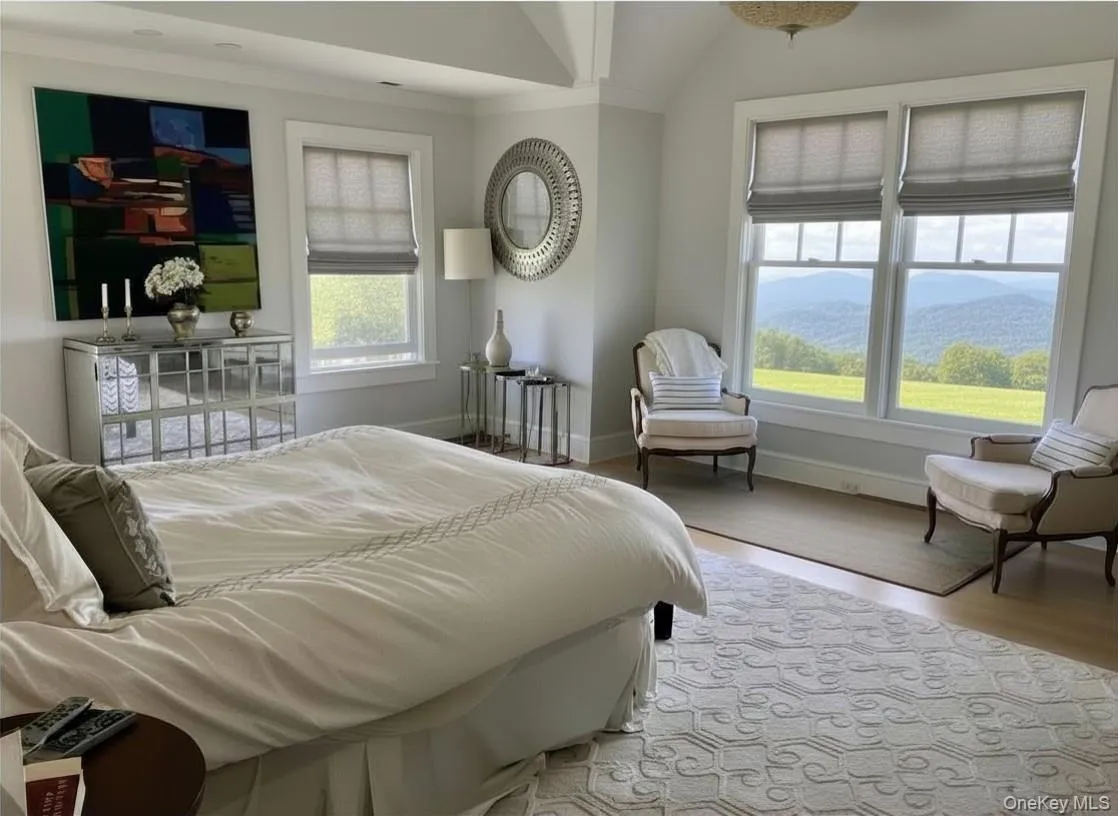 The Large Primary Bedroom Suite Enjoys Abundant Light, Vaulted Ceiling and Spectacular Views The Large Primary Bedroom Suite Enjoys Abundant Light, Vaulted Ceiling and Spectacular Views