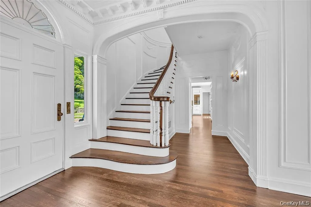 The Staircase located off to the side of the Center Hall to Allow the Clear Through-View from Front to Back The Staircase located off to the side of the Center Hall to Allow the Clear Through-View from Front to Back