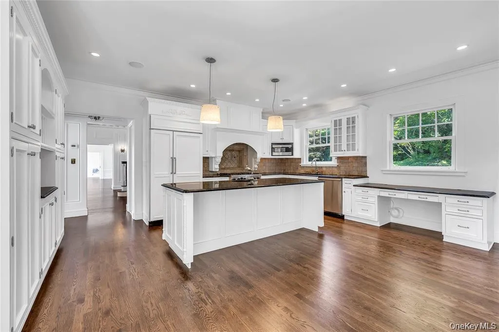 Large Granite Kitchen with Fireplace and Entrance to Both Front and Rear Yards...Plus Amazing Waterviews! Large Granite Kitchen with Fireplace and Entrance to Both Front and Rear Yards...Plus Amazing Waterviews!