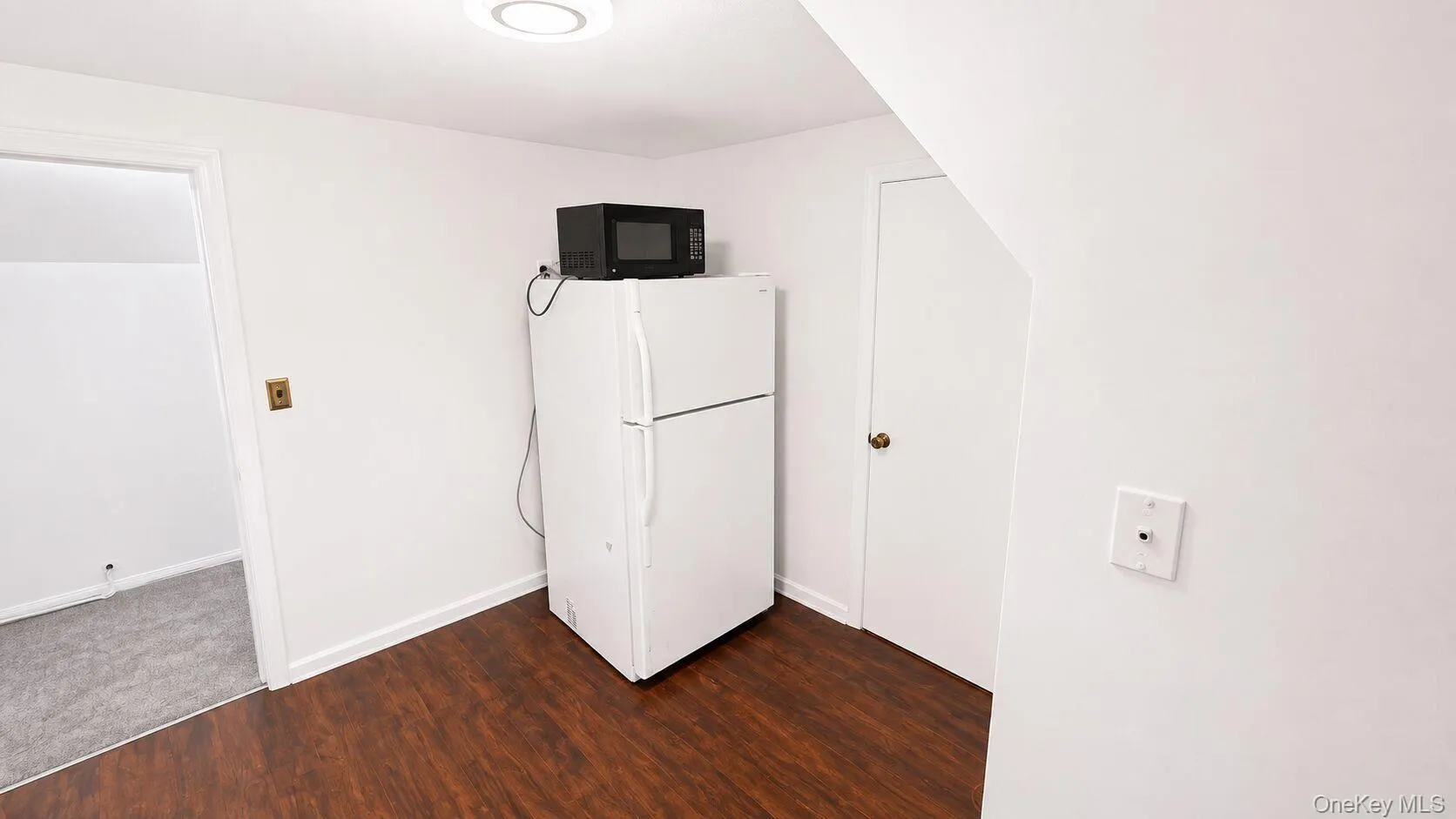 Kitchen with refrigerator and microwave. Kitchen with refrigerator and microwave.
