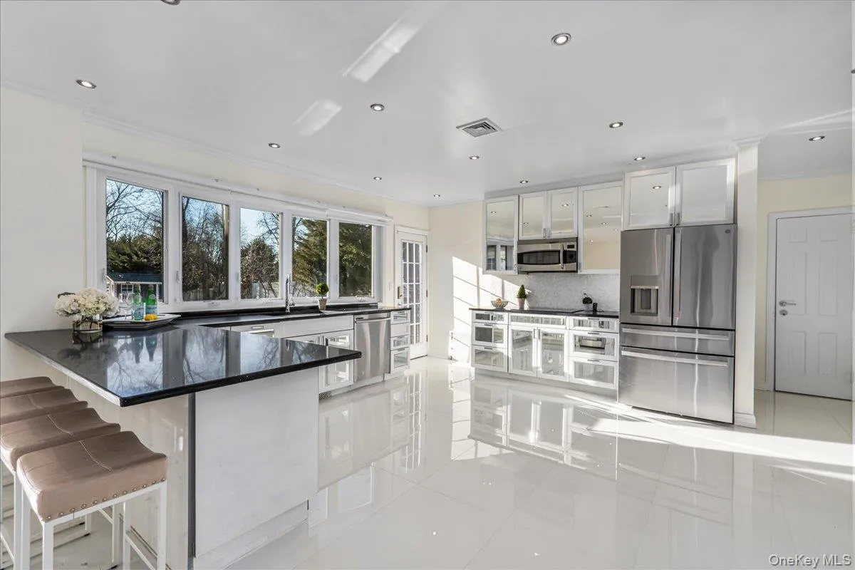 Spacious kitchen with granite countertops and stainless steel appliances. Spacious kitchen with granite countertops and stainless steel appliances.