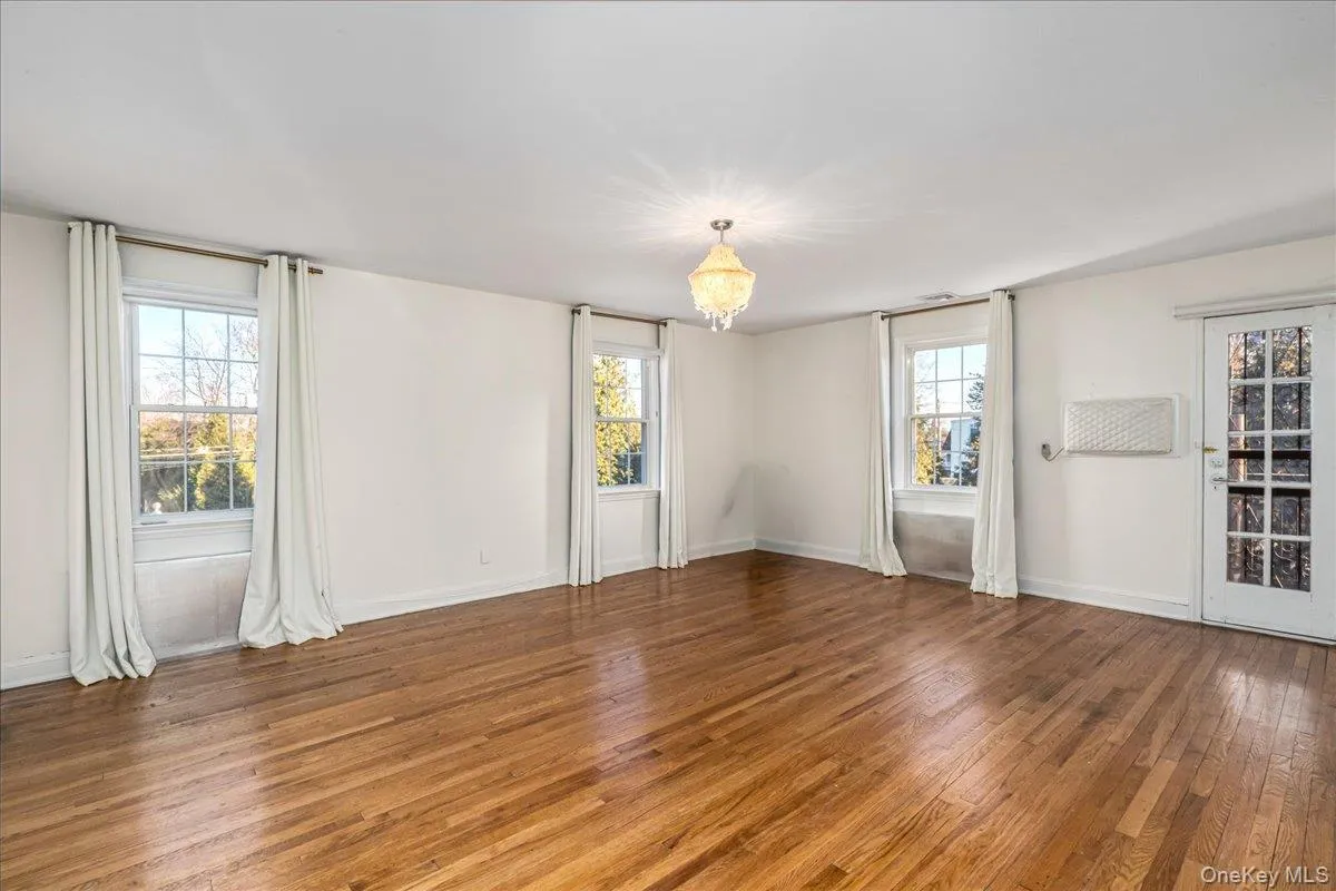 Spacious ensuite primary bedroom with full bath, two closets, hardwood floors and a balcony. Spacious ensuite primary bedroom with full bath, two closets, hardwood floors and a balcony.