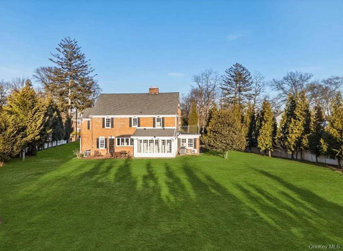 Expansive, flat backyard with brick terrace and room for a pool. Expansive, flat backyard with brick terrace and room for a pool.