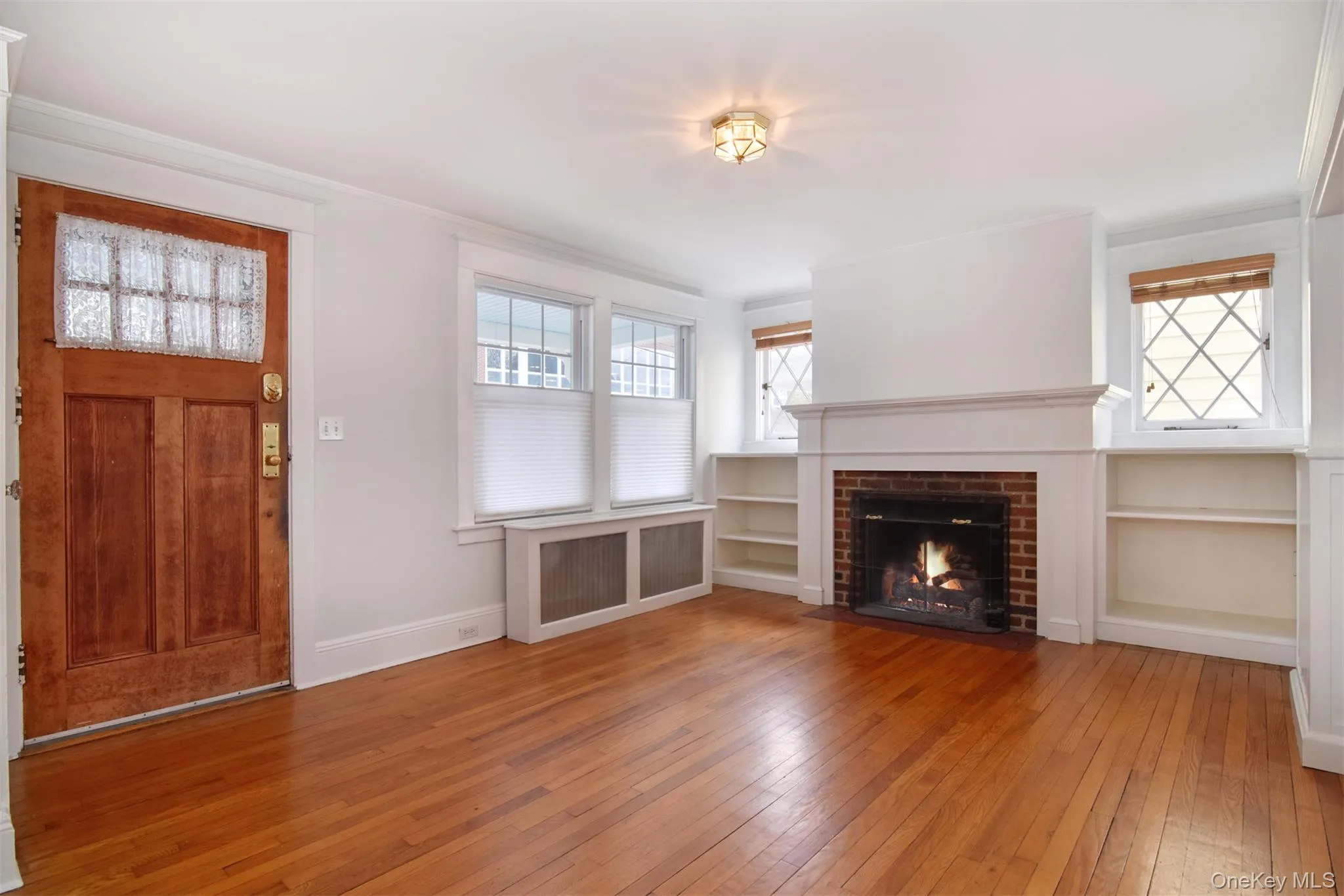 Living room with gas fireplace and built-in bookcases Living room with gas fireplace and built-in bookcases