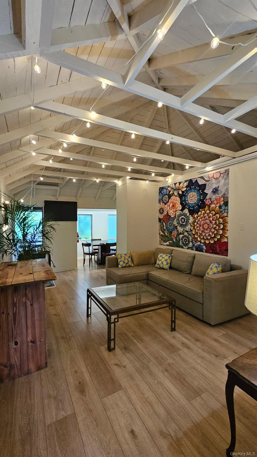 Living area with wood finished floors and wood ceiling Living area with wood finished floors and wood ceiling