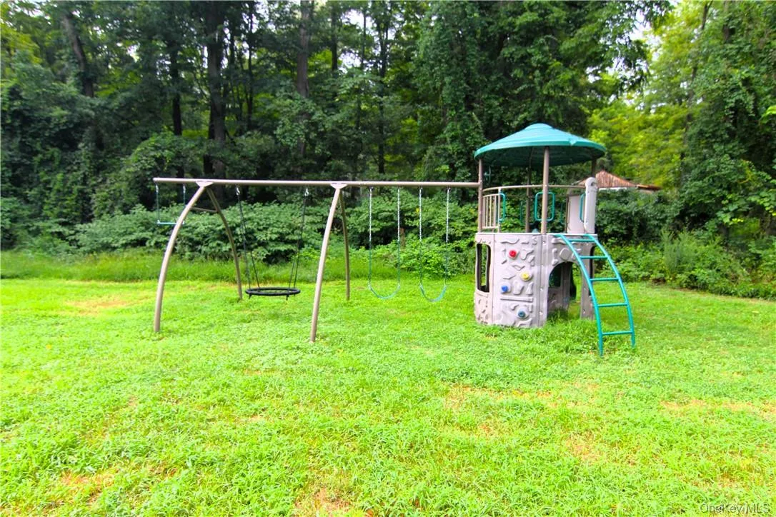 View of play area with a lawn View of play area with a lawn