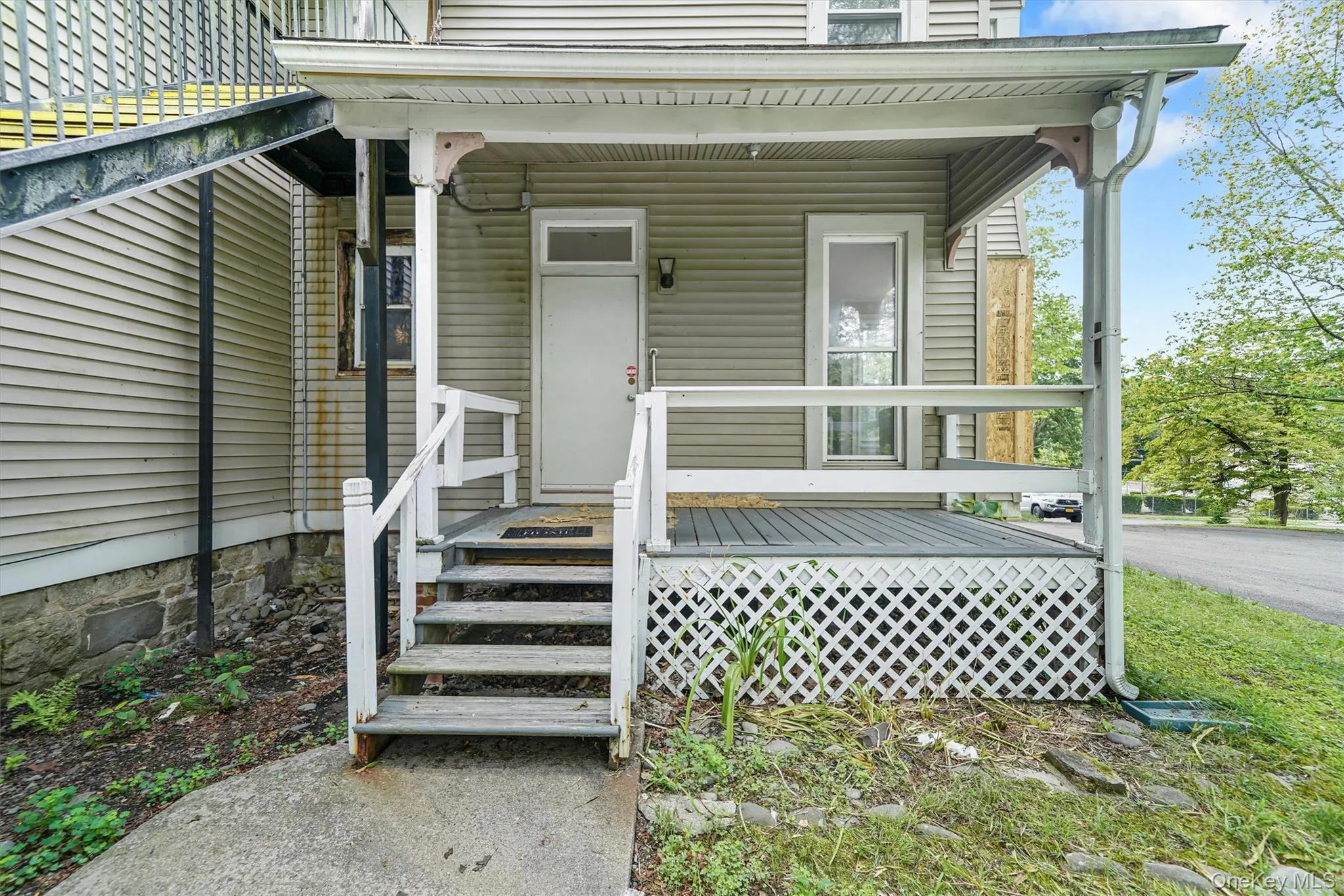 Entrance to property with a porch Entrance to property with a porch