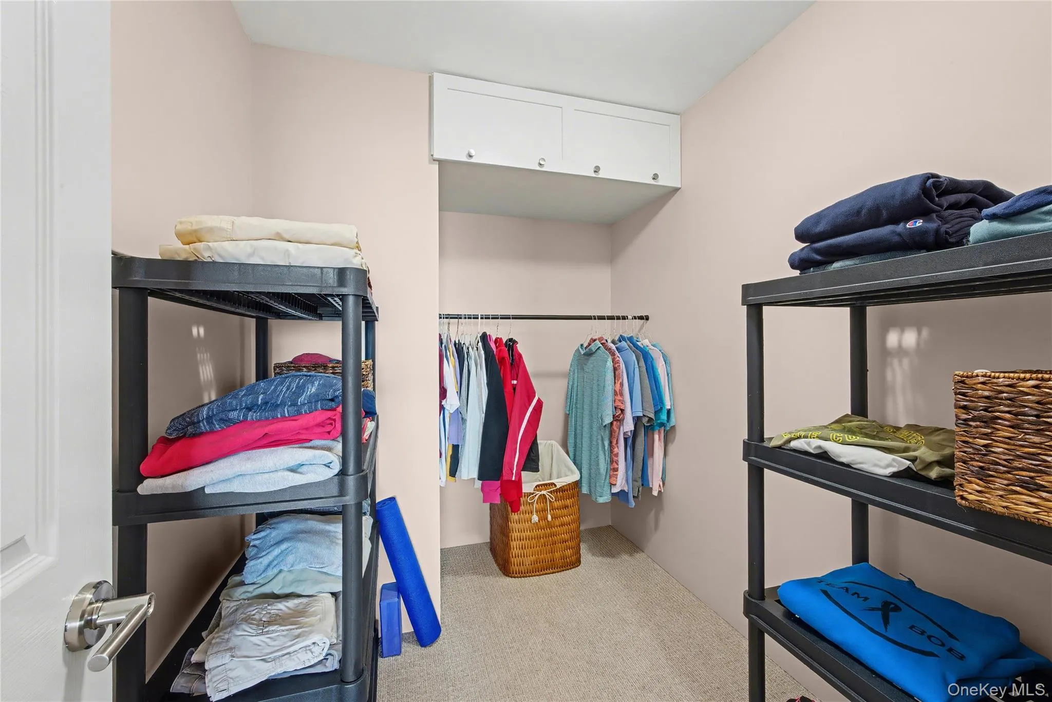 Large Primary walk-in Closet Large Primary walk-in Closet