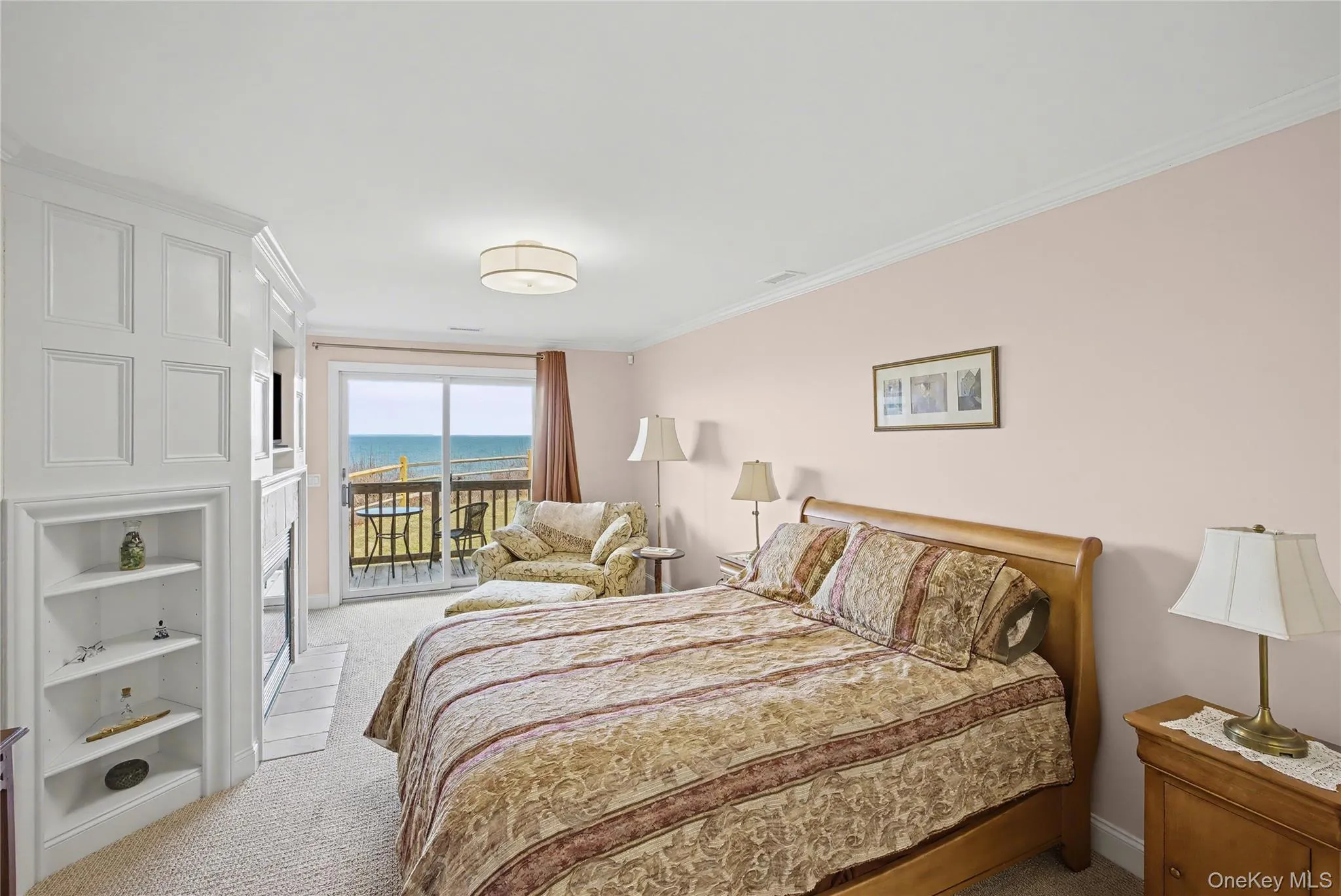 Primary Bedroom with sliding glass doors to the deck and Long Island Sound Views. Primary Bedroom with sliding glass doors to the deck and Long Island Sound Views.