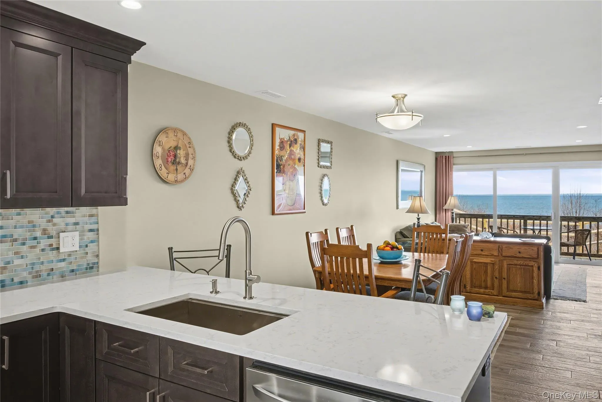 Kitchen with quartz counters, work station sink. Kitchen with quartz counters, work station sink.