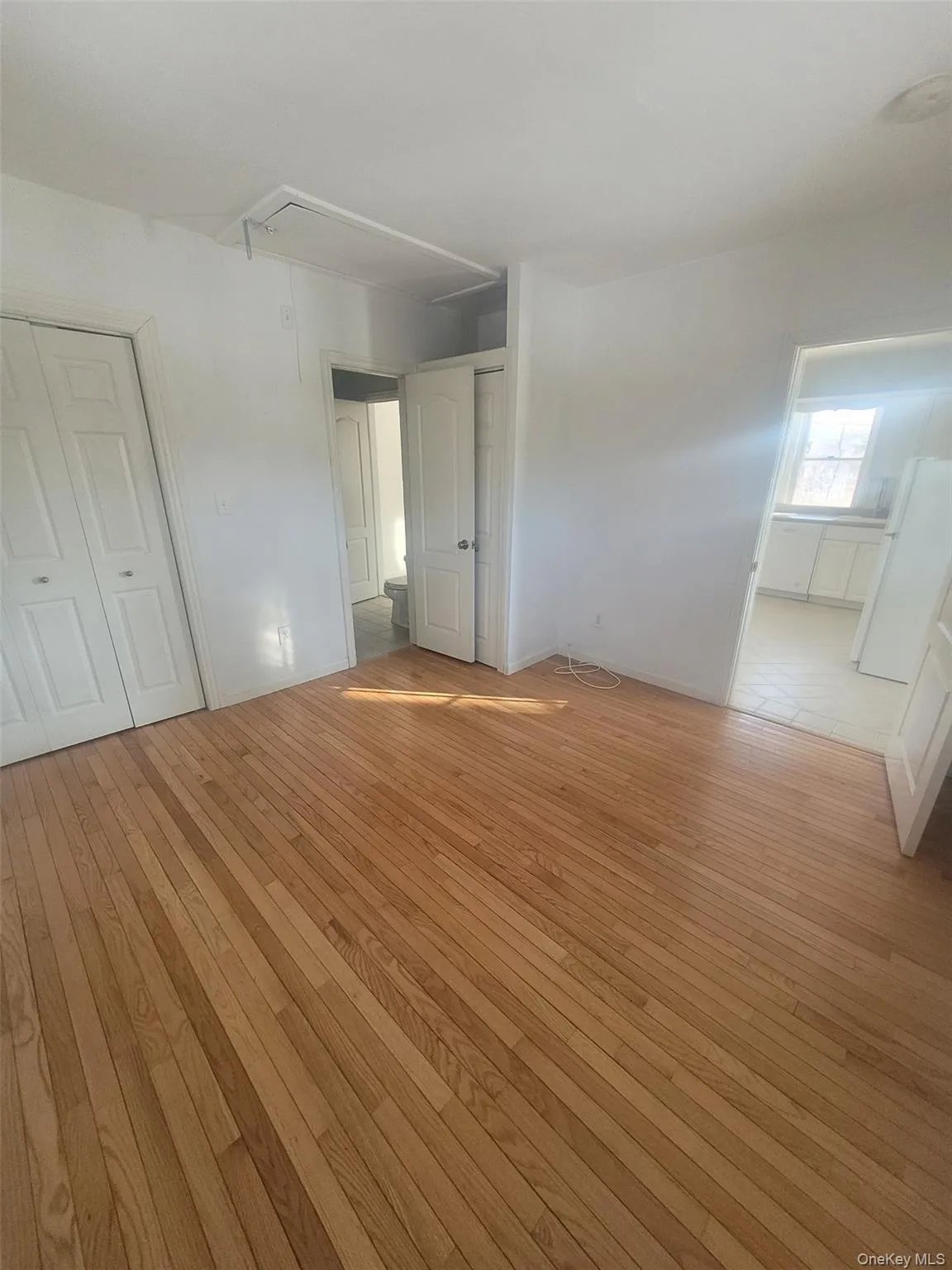 Empty bedroom with hardwood floors Empty bedroom with hardwood floors